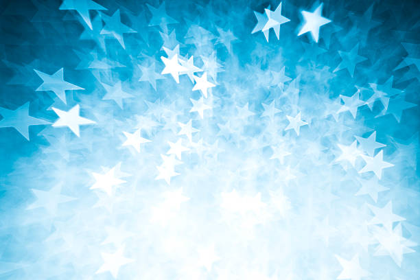 Blurred blue star shape lights stock photo