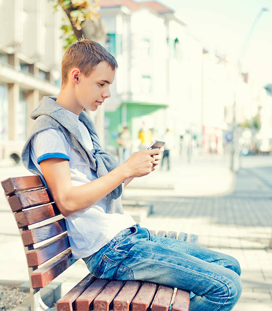 istock Teenager with mobile phone 170452950