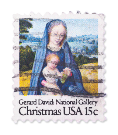 Vintage US Christmas stamp of painting by Gerard David: National Gallery. Isolated on white with light shadow. Canon 5D Mark II.