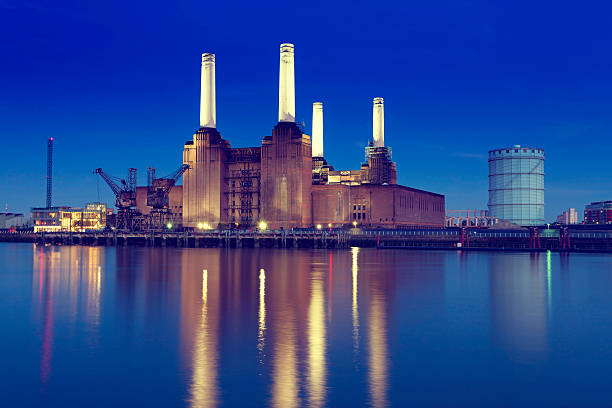 Skyline of Battersea Power Station with lake reflection View of the Battersea Power Station in London. window chimney london england residential district stock pictures, royalty-free photos & images