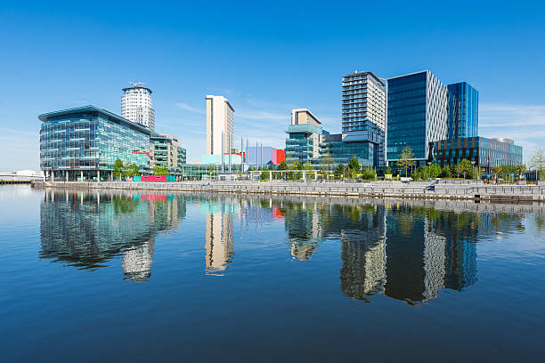Media City UK, Salford Quays, Manchester Wide angle view of modern architecture at Salford Quays on a clear summers day. manchester england stock pictures, royalty-free photos & images