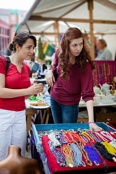 istock two young women shopping second hand at the flea market 170453622