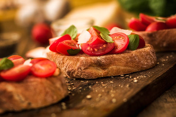 Bruschetta Bruschetta with tomatoes, basil and parmesan bruschetta stock pictures, royalty-free photos & images