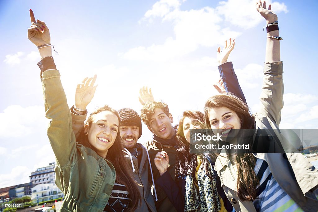 Happy group of friends Happy group of italians friends on the promenade. Adolescence Stock Photo