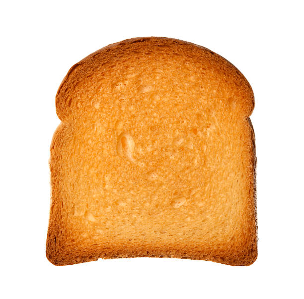 Close up from above single slice of twice-baked bread isolated rusk on white zwieback toast stock pictures, royalty-free photos & images