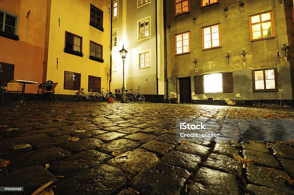 Old town in Stockholm, rain wet cobblestones Light reflecting in wet cobblestones Abstract Stock Photo