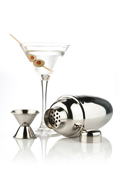 Martini Cocktail, Shaker and Measuring Cup on reflective white backdrop Martini Glass, Shaker and Measuring Cup on Reflective White Background.  Similar Photos on Lightbox COCKTAIL AND DRINKS http://i1215.photobucket.com/albums/cc503/carlosgawronski/CocktailsandDrinks.jpg cocktail shaker photos stock pictures, royalty-free photos & images