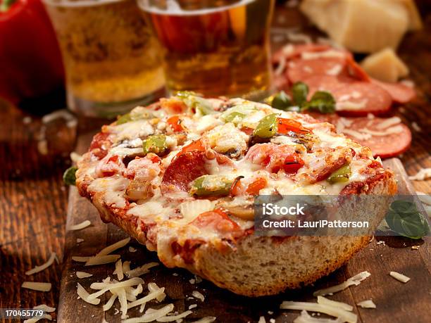 Deluxe French Bread Pizza Stock Photo - Download Image Now - Baguette, Pizza, Alcohol - Drink