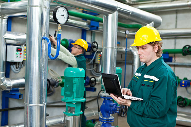 Worker control devices in a Heating Plant stock photo