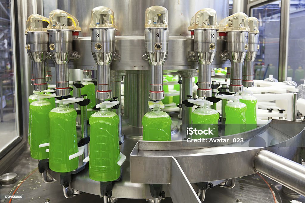 Filling line Liquid detergent factory.  Please see more of my photo and video clips factory for the production of detergent. Shallow DOFF. Packaging Stock Photo