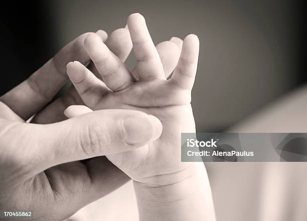 Mother Holding Babys Hand Stock Photo - Download Image Now - Child, Close-up, Palm of Hand