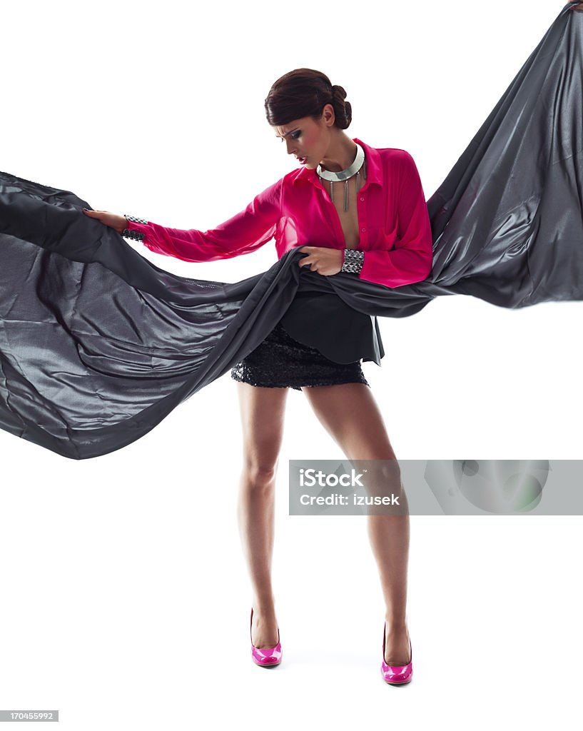 Fashionable Woman with Scarf Full Lenght Portrait of Beautiful Woman Wearing Pink Top and Black Mini Skirt posing with Scarf. Studio shoot, white background. 20-24 Years Stock Photo