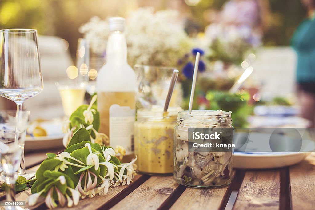 Smörgåsbord with pickled herring and snaps Herring Stock Photo