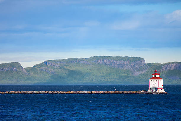 Thunder Bay, Ontario, Canada Thunder Bay lighthouse with the Sleeping Giant rock formation in the background, Ontario, Canada. provincial park stock pictures, royalty-free photos & images