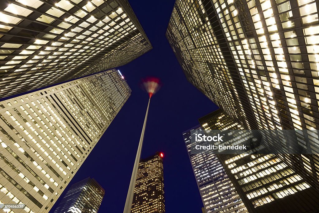 Toronto, Canada The financial district and flag pole with the Canadian flag blown by the wind in downtown Toronto. Bank - Financial Building Stock Photo