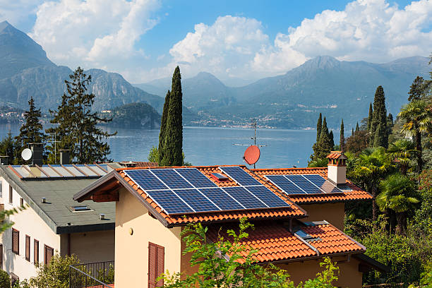 Lake Como Italy Houses with Solar Cells House with solar cells on the shores of Lake Como, Italy como italy photos stock pictures, royalty-free photos & images