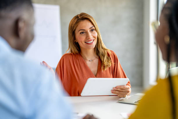 istock Man and woman are visiting insurance agent in office. 1704576154