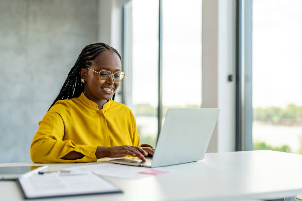 istock Smiling Businesswoman Using A Laptop Computer 1704584274