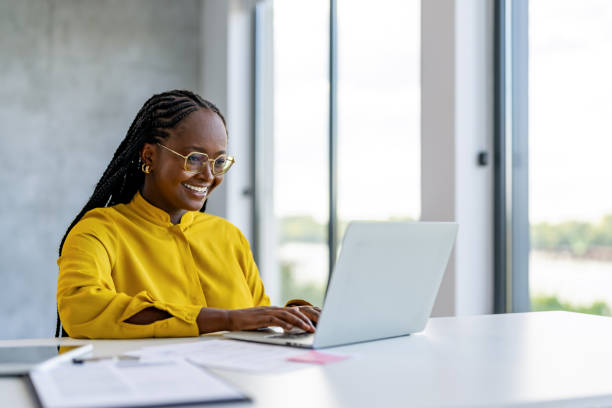 istock Lady Using Laptop Working Online Sitting In Office 1704584477