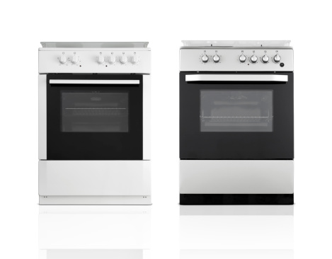 Modern induction electric hob cooker with control panel buttons. Electric hob detail closeup. Stove top panel controls of modern kitchen. Electric hob ceramic surface, and touch control panel.