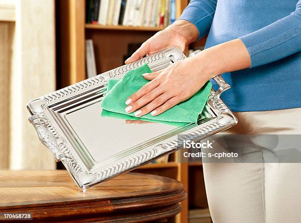 Woman Cleaning Silverware Stock Photo - Download Image Now - Cleaning, Silver - Metal, Silver Colored
