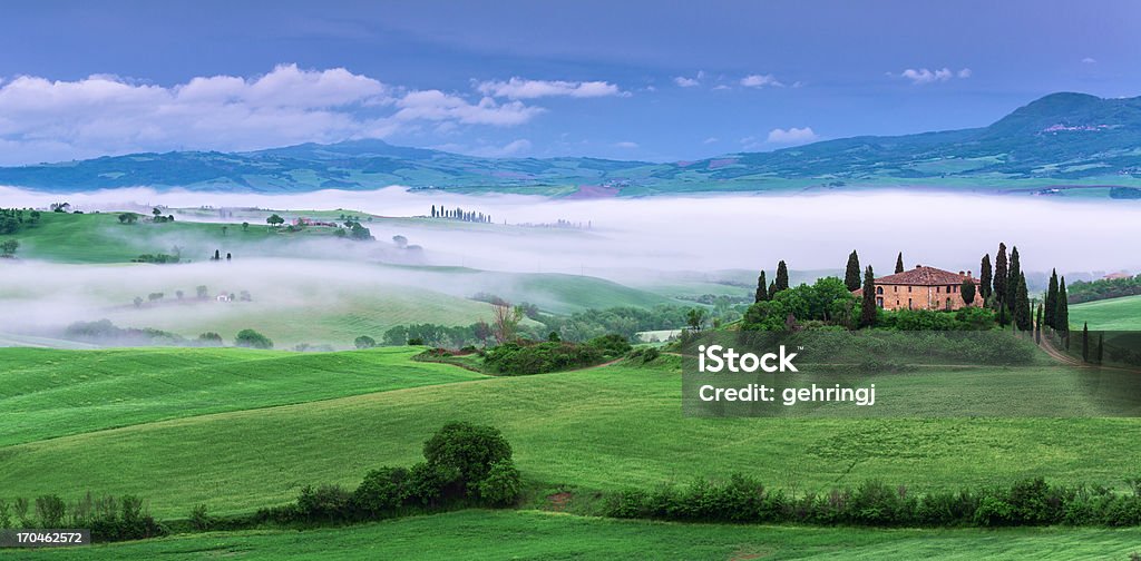 Farm in Tuscany at dawn Farm in Tuscany at dawn with wonderful mist Tuscany Stock Photo