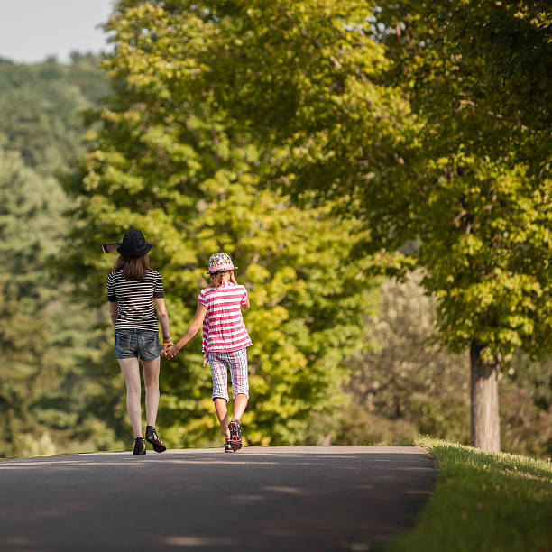 istock Two girls walks on road in Pocono mountains 170462608