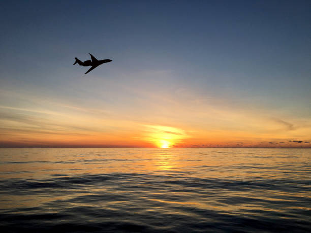 istock Silhouette of a luxury private jet taking off at dawn 1704627753