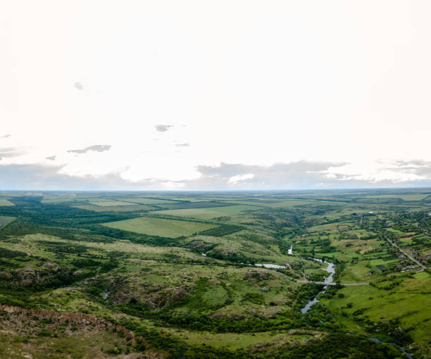 istock Top view from drone on green hills area 1704635012