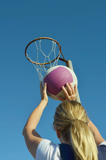 istock Young kid shooting a basketball into a netball 170463545