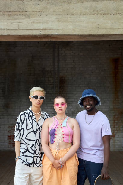 istock Three young people posing as band urban looking at camera 1704636720