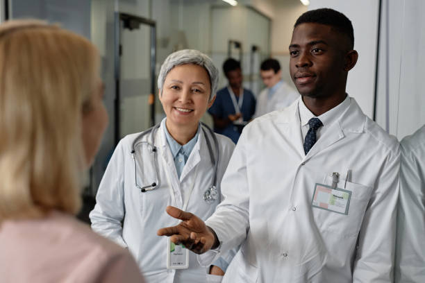 istock Young confident male general practitioner talking to his assistant 1704651190
