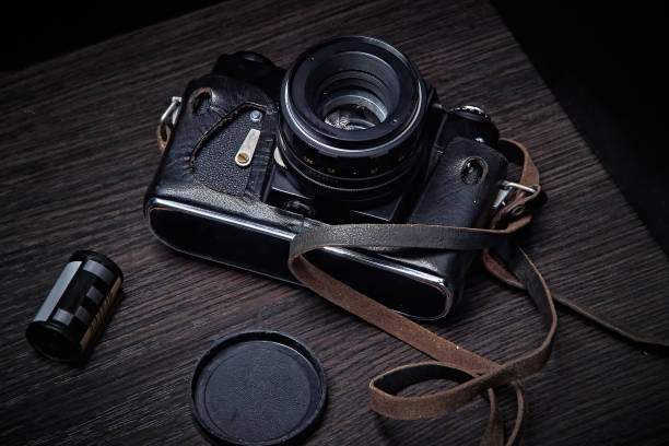 istock An old 35 mm film camera in a worn case 1704653966