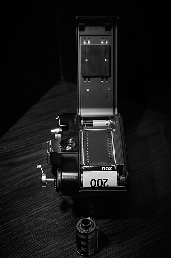 Installing 35mm film in an old camera - rear view.
