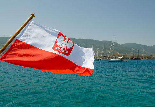 The Maltese red merchant flag with a white Maltese cross