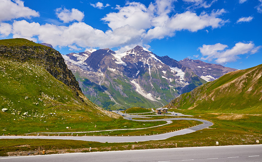 Grossglockner Panoramic Road to Pasterze Glacier, Austria. Scenic panorama of the among austrian Alps mountains with summits and blue sky clouds. Famous travel destination in Europe