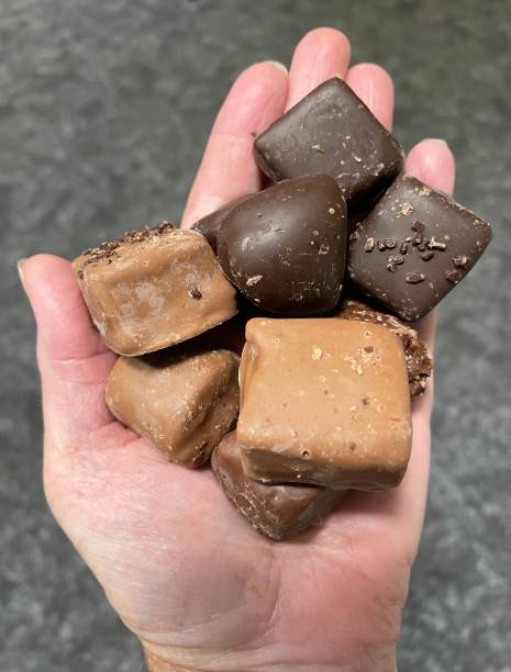 istock Hand full of chocolate candy 1704744763