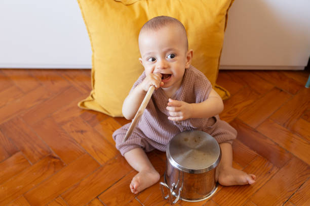 istock 8 month old baby boy playing 1704765287
