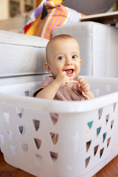 istock 8 month old baby boy playing 1704765804