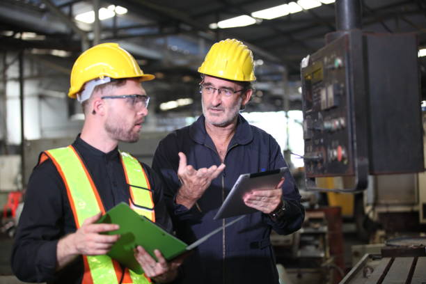 istock worker or engineer working in factory with safety uniform , safety hat and safety glasses , image is safety concept or happy workplace 1704805367
