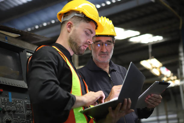 istock worker or engineer working in factory with safety uniform , safety hat and safety glasses , image is safety concept or happy workplace 1704807614