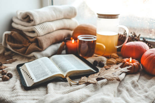 istock Open bible in autumn interior, good morning 1704826743