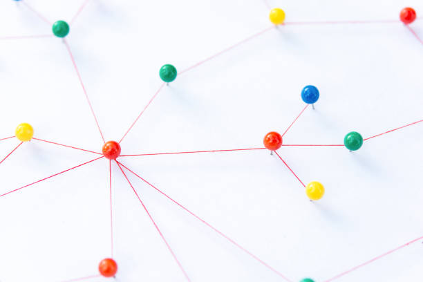 istock Linking entities, Blockchain, social media, Communications Network, The connection between the two networks. Network simulation on paper linked together by yarn 1704831050