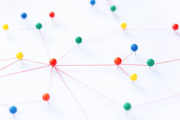 istock Linking entities, Blockchain, social media, Communications Network, The connection between the two networks. Network simulation on paper linked together by yarn 1704831567