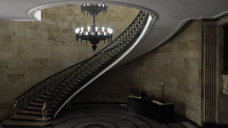 Antique Lit Chandelier At The Empty Hall Near Staircase At The Ministry Of Treasure Building In Rio de Janeiro, Brazil. Zoom Out