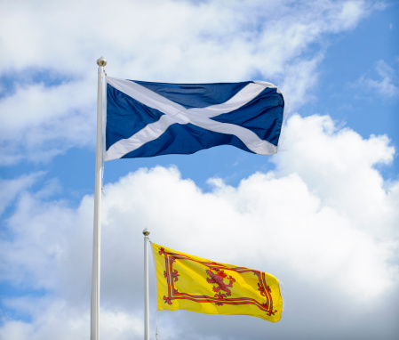 St Andrew's Cross of the national Scottish Saltire flag, and the Lion Rampart emblem on the Royal Standard of Scotland flag.