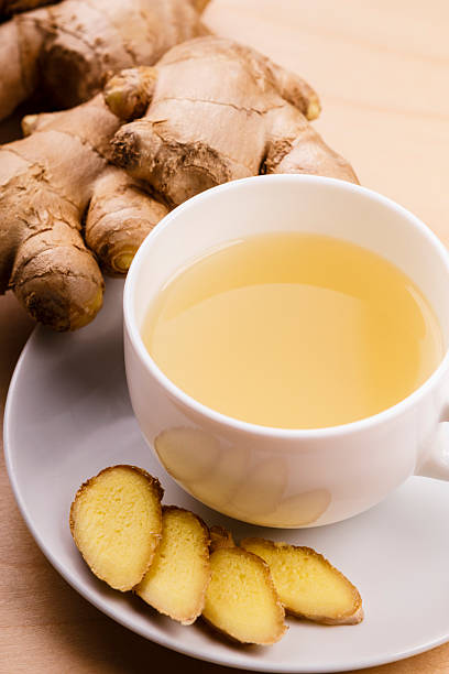 ginger tea ginger tea and ginger roots  ginger spice stock pictures, royalty-free photos & images