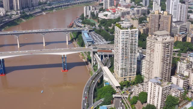 Traffic over river roads in Chinese Chongqing city. Aerial view