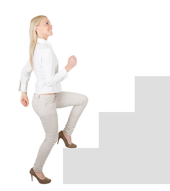istock Successful businesswoman walking up a staircase 170493676