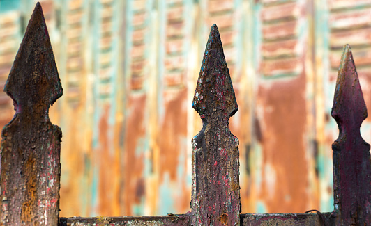 France: Weathered Rusty Metal Gate Spikes Close-Up
